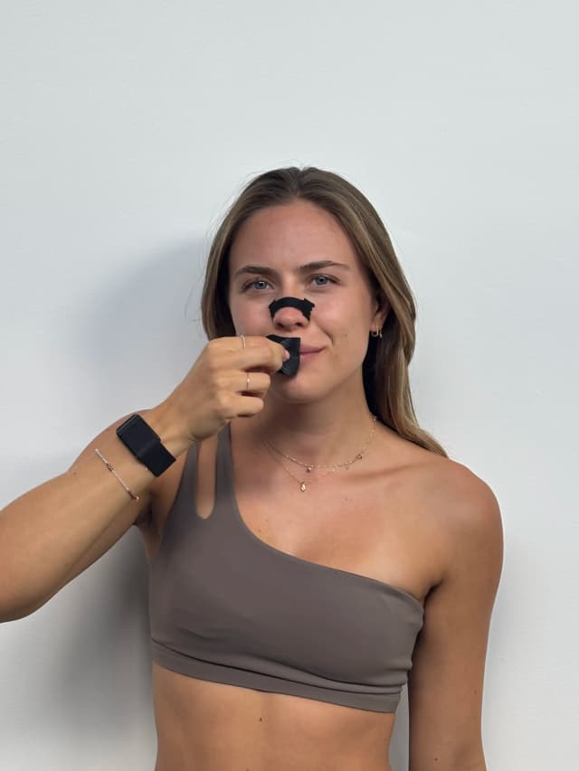 Woman wearing nasal strips